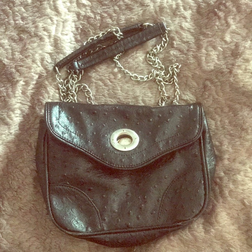 Black faux leather textured crossbody bag.